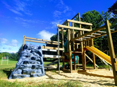 Kid-friendly bed & breakfast resort with playground, pool, volleyball, yard games, and a firepit near Lake Michigan!